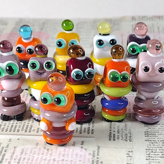 Glass robot beads raising funds for Beads of Courage UK
