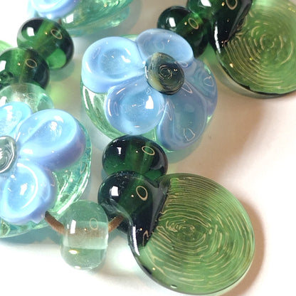 Blue and pale apple green daisy lampwork bead set Jolene Beads