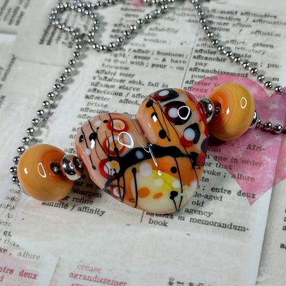 Tan and orange patchwork heart necklace Jolene Beads